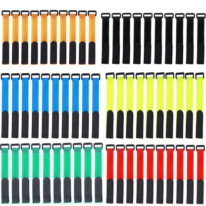 Fishing rod bundle secured with an adjustable black hook and loop strap, fishing gear organizer