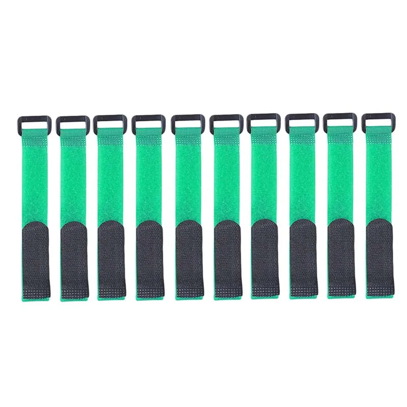 Angler's hands securing fishing rods together with a black hook and loop tie strap, fishing tools