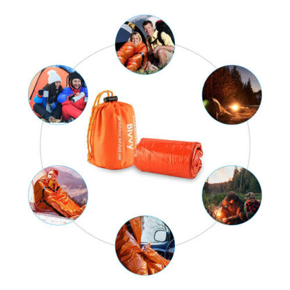 Thermal bivy emergency sleeping bag in a forest setting, highlighting its outdoor survival purpose.