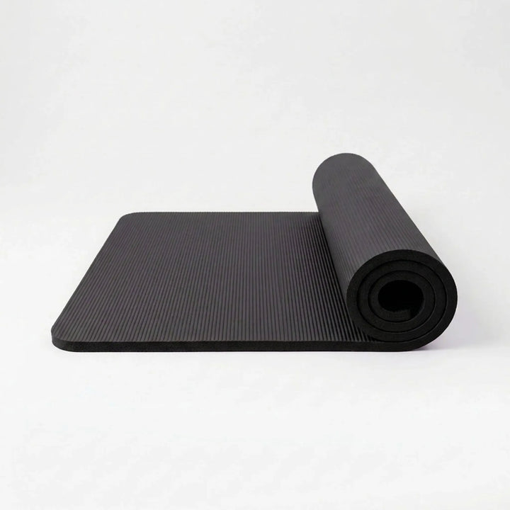 Unisex non-slip yoga mat, thick NBR foam for comfortable poses & joint support during home fitness exercises.