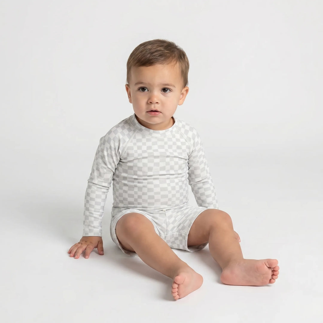 Active kids' long sleeve rash guard swim set, offering UV protection for toddlers in water sports.