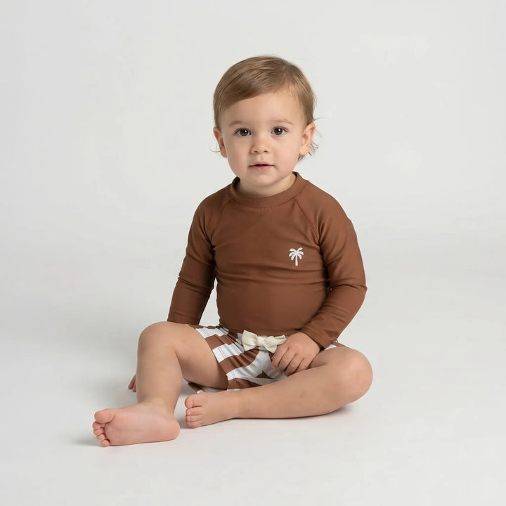 Vacation-ready toddler long sleeve rash guard swim set for sun-protected beach and pool fun.