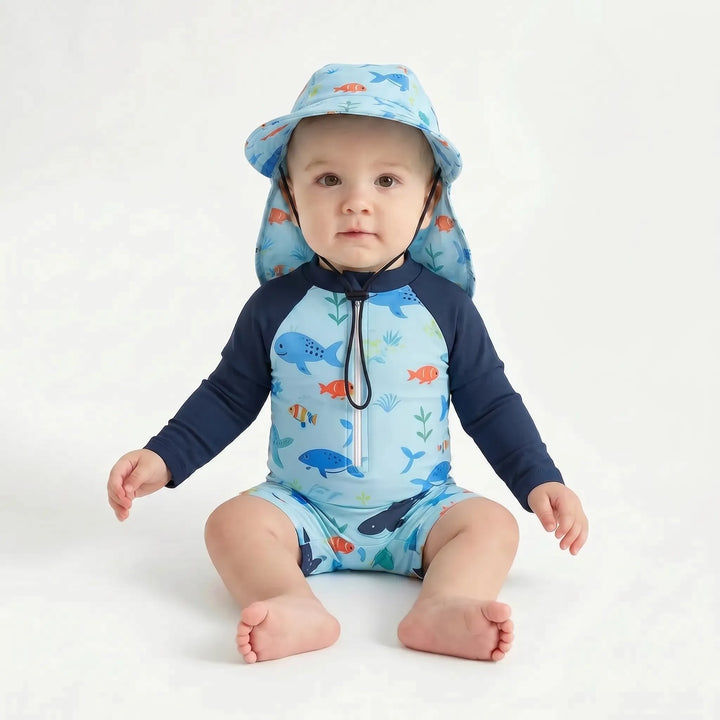 UPF 50+ long sleeve toddler swim romper. Sun protective baby rash guard for beach, water play & summer fashion.