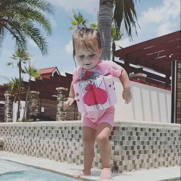 Toddler UV protection swim vest with built-in shorts for pool safety.