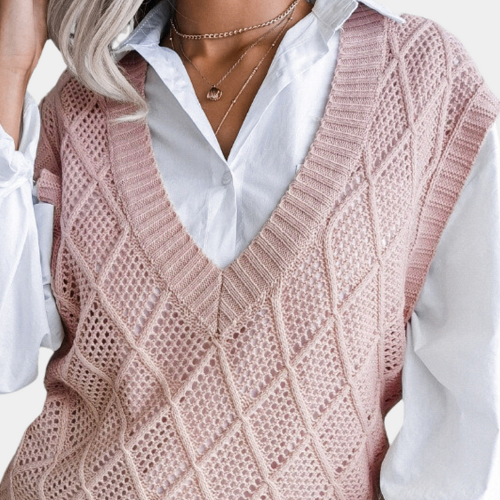 Stylish women's knitted sweater in a trendy design, offering comfort & warmth for cooler seasons.