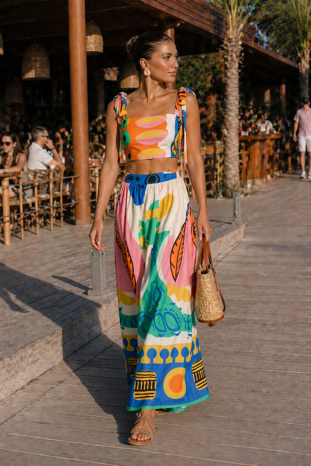 Chic women's tropical print summer outfit: crop top & high-waisted maxi skirt set. Perfect for vacations.