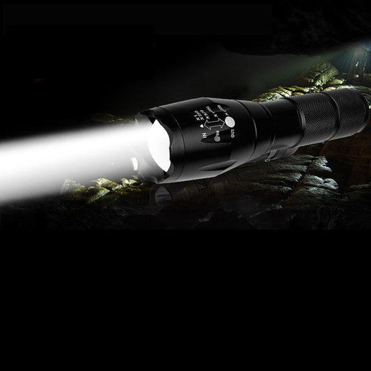 Two high lumen LED tactical flashlights, black, shown with beams for outdoor lighting