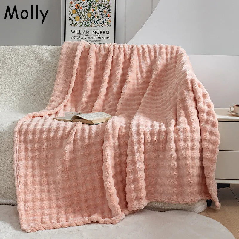 Ultra-soft bubble fleece throw blanket for living room comfort.