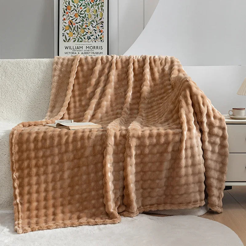 Soft bubble texture fleece throw blanket, ideal for cozy home comfort in living room or bedroom.