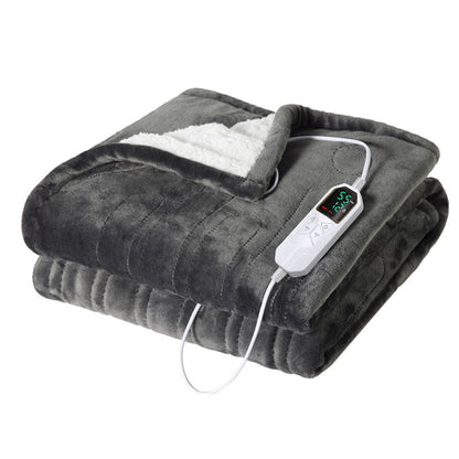 Electric heated blanket, spread out, showcasing its size and plush material for a snug warmth solution