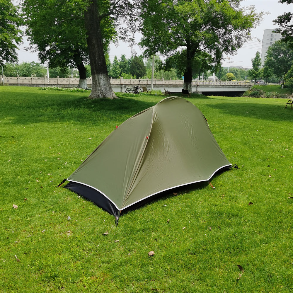 Ultralight camping bivy tent in a carrying sack, ready for solo hiking gear transport