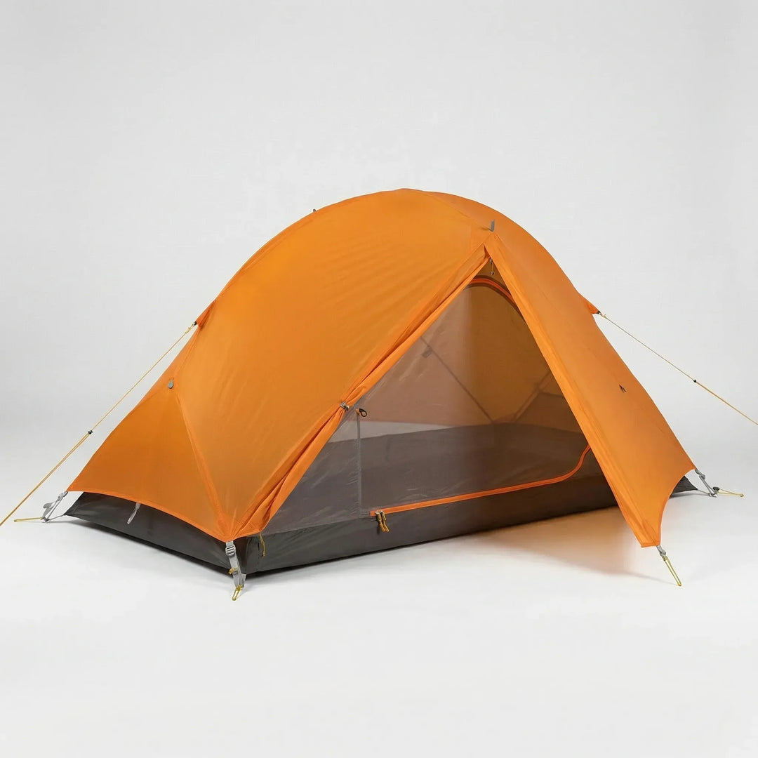 A solo adventurer rests inside an ultralight 1-person backpacking tent amidst a mountain landscape.