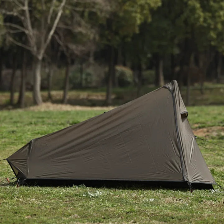 Stormproof 1-person backpacking tent set up in a scenic outdoor environment