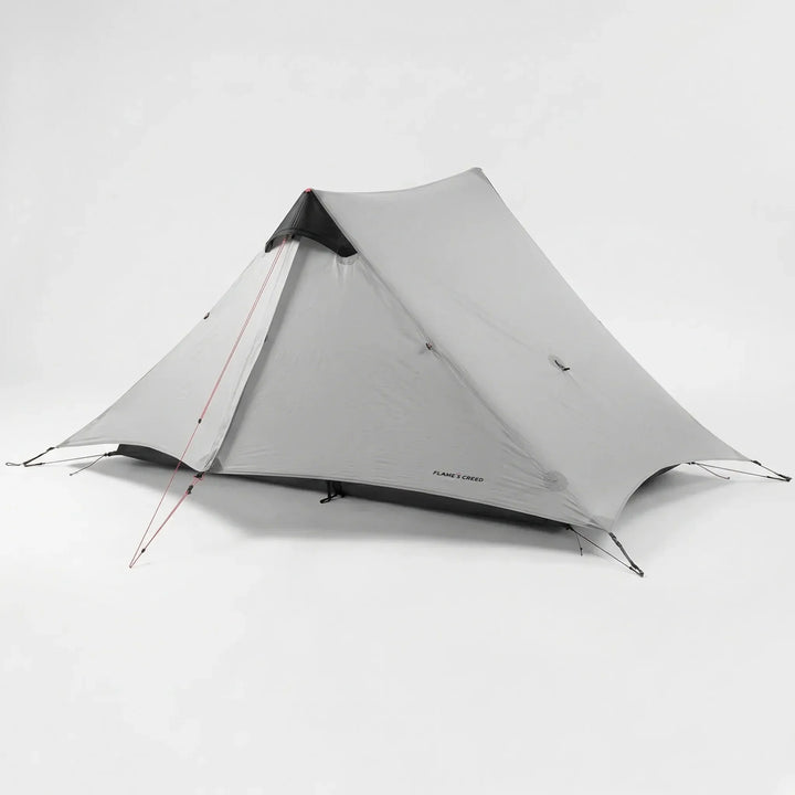 Compact ultralight 2-person trekking tent packed in a stuff sack, ready for backpacking & hiking trips.