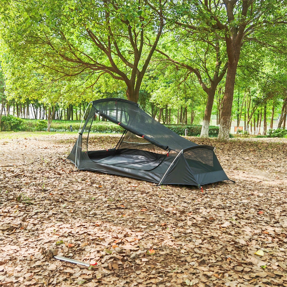 Setup view of ultralight 2-person waterproof tunnel camping tent in nature