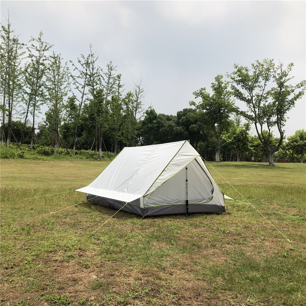 Compact A-frame duo trekking pole tent, packed in a compression sack.
