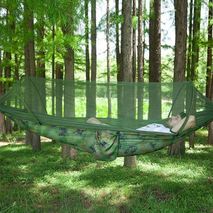 Ultralight camping hammock with integrated mosquito net, perfect for bug-free outdoor adventures & hiking