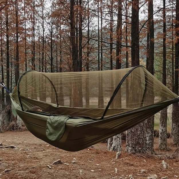 Durable camping hammock with a secure bug net, designed for peaceful sleep in the wilderness