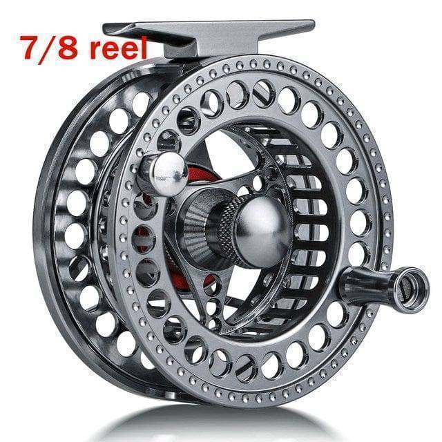 Ergonomic handle of the ultralight fly fishing rod, paired with reel, designed for comfortable angler use.