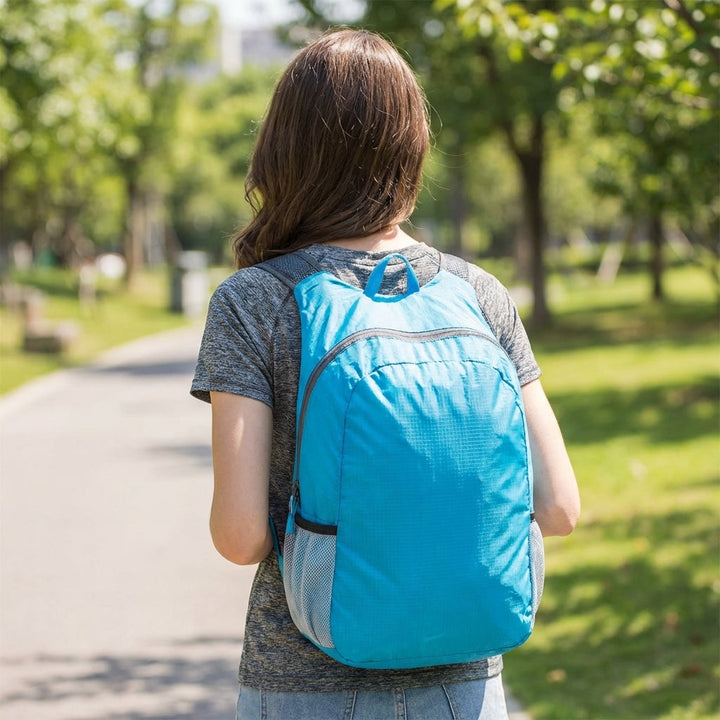 Ultralight foldable travel daypack with a secure back pocket. Unisex, perfect for daily trips & carry-on.
