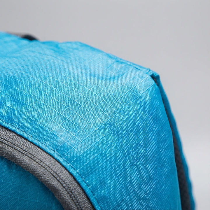 Easily packable ultralight foldable backpack. Unisex travel daypack fits into its own back pocket.