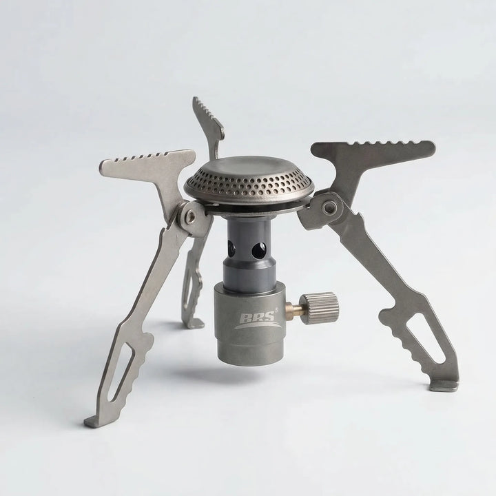 Compact titanium folding camping stove for hiking & backpacking. Essential portable camp gear for outdoor cooking.