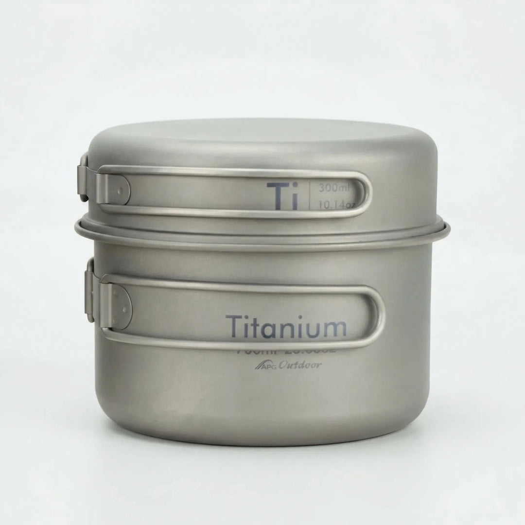 Portable ultralight titanium cookware set for camping, hiking, and travel. Compact folding design for outdoor cooking.