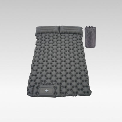 Ultralight inflatable camping mattress with built-in foot pump, shown deflated for portability.