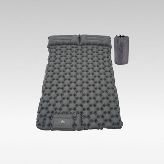 Ultralight inflatable camping mattress with built-in foot pump, shown deflated for portability.