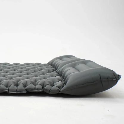 High-angle view of inflated camping mattress, highlighting its thick cushioning.