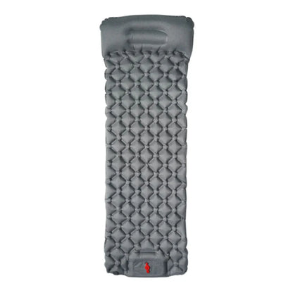 A person easily carrying a packed ultralight camping mattress, emphasizing portability.