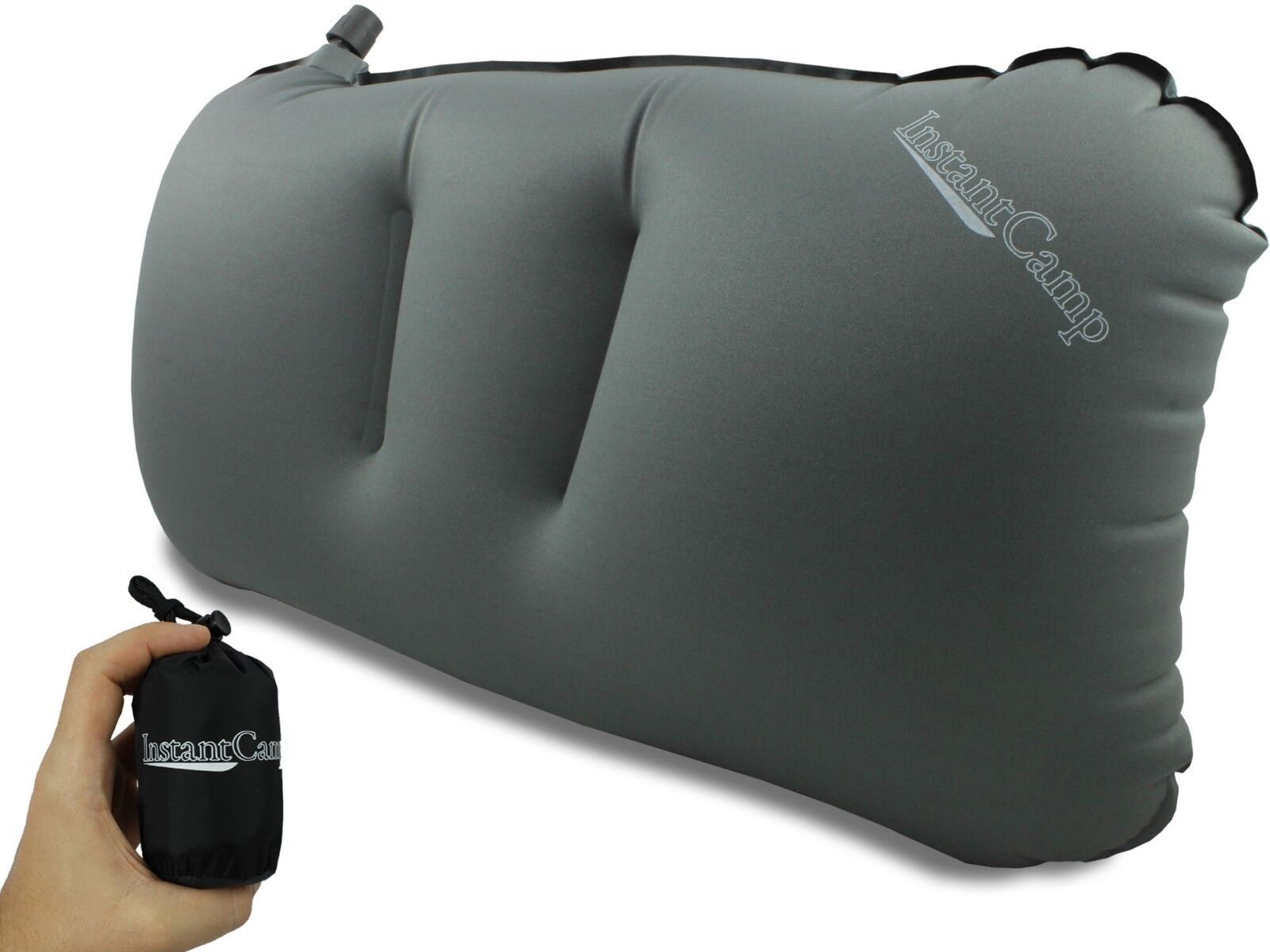 Inflatable neck support pillow, gray, used by a camper relaxing in a tent