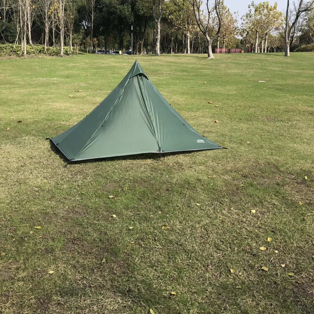 Pyramid tent with trekking poles, showing the ventilation system for air circulation.