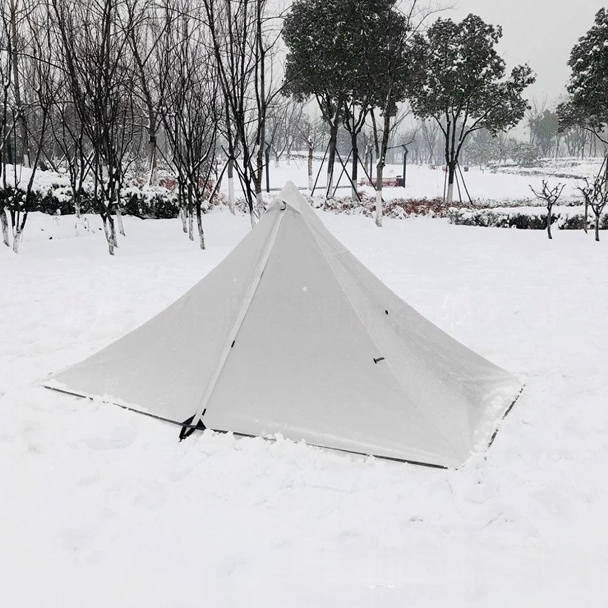 Durable 1-2 person camping shelter, front view, highlighting its stable pyramid design.