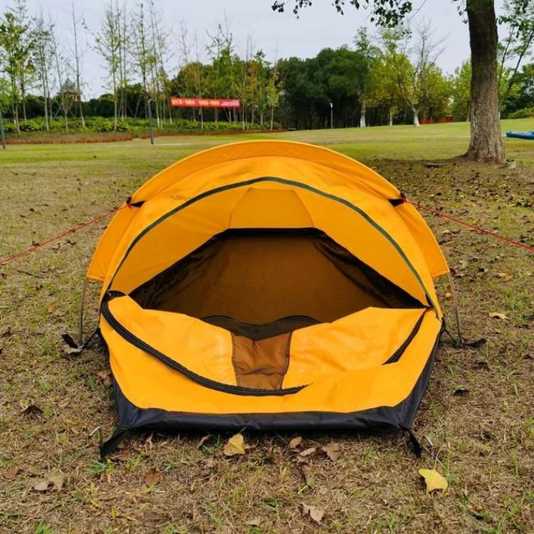 Close-up of the waterproof fabric of an ultralight single person backpacking tent with rain fly