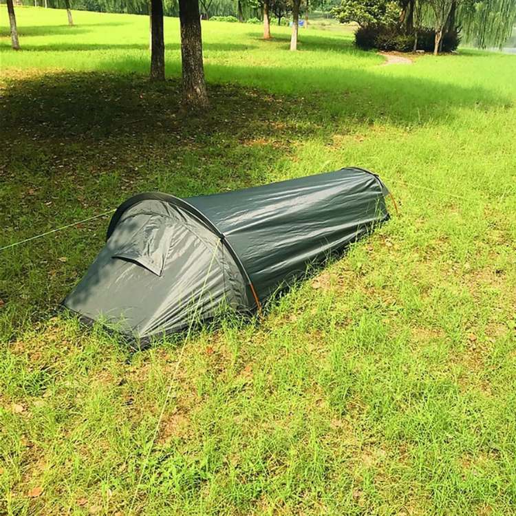 Single person backpacking tent interior, showing spacious sleeping area and gear pockets, ultralight