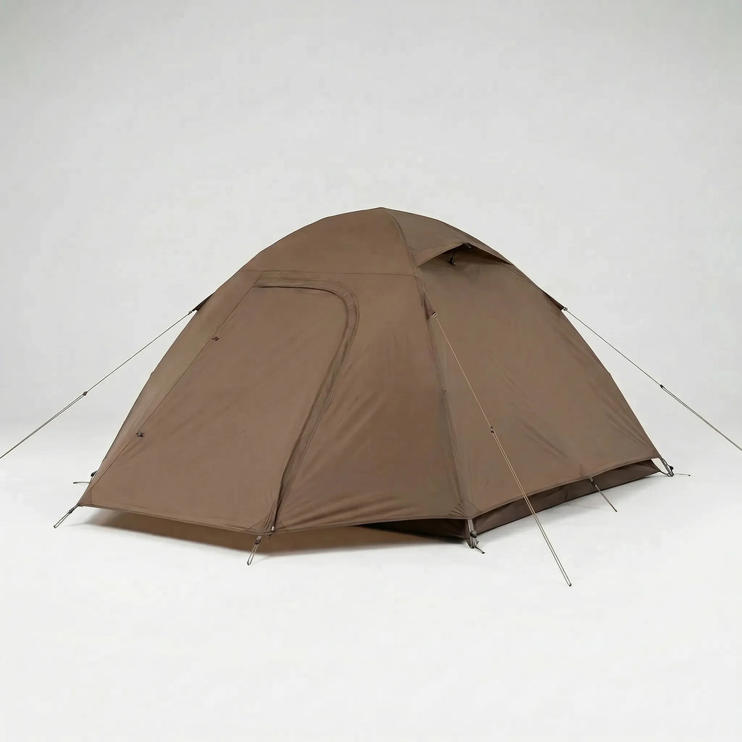 Compact ultralight solo dome tent set up in a scenic forest clearing, ideal for backpacking & 3-season camping.