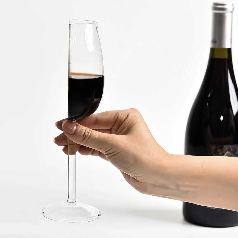 Elegant half-cut sculptural wine glass, a unique piece of modern glassware for entertaining & stylish home decor.
