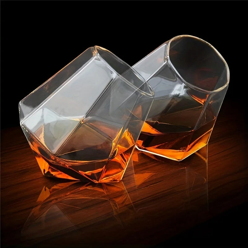 Unique tilted crystal whiskey glass for spirits. Elegant barware tumbler, perfect for a home bar or gift.