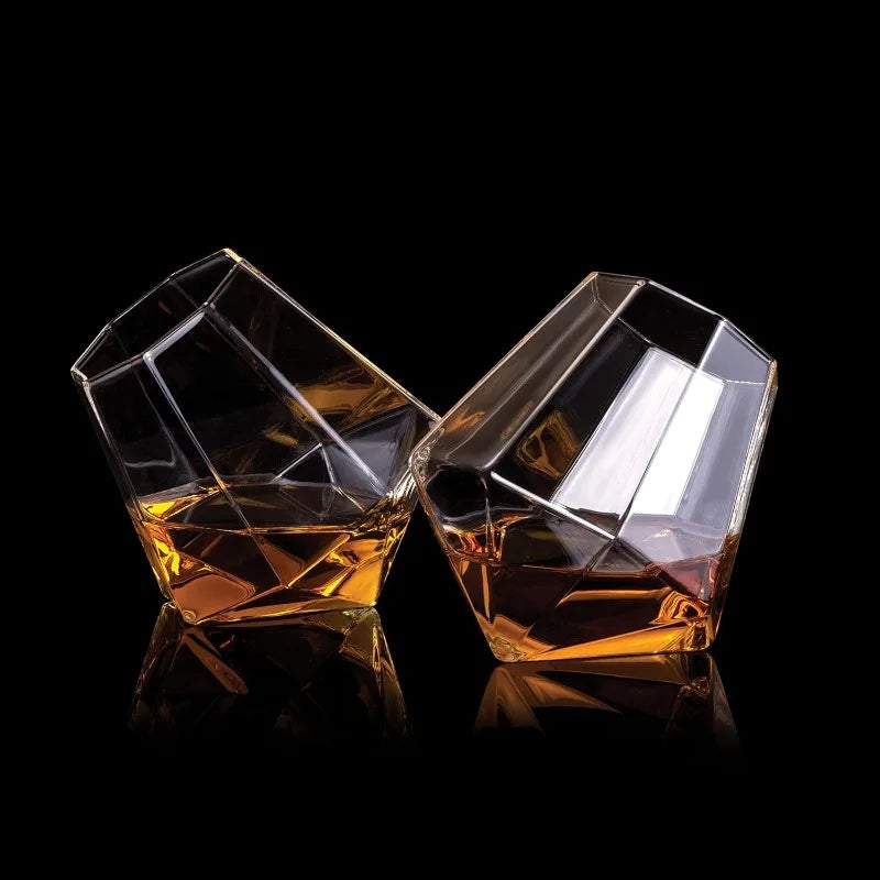 Sophisticated tilted crystal whiskey glass, ideal for spirits. High-quality drinkware tumbler with a unique design.