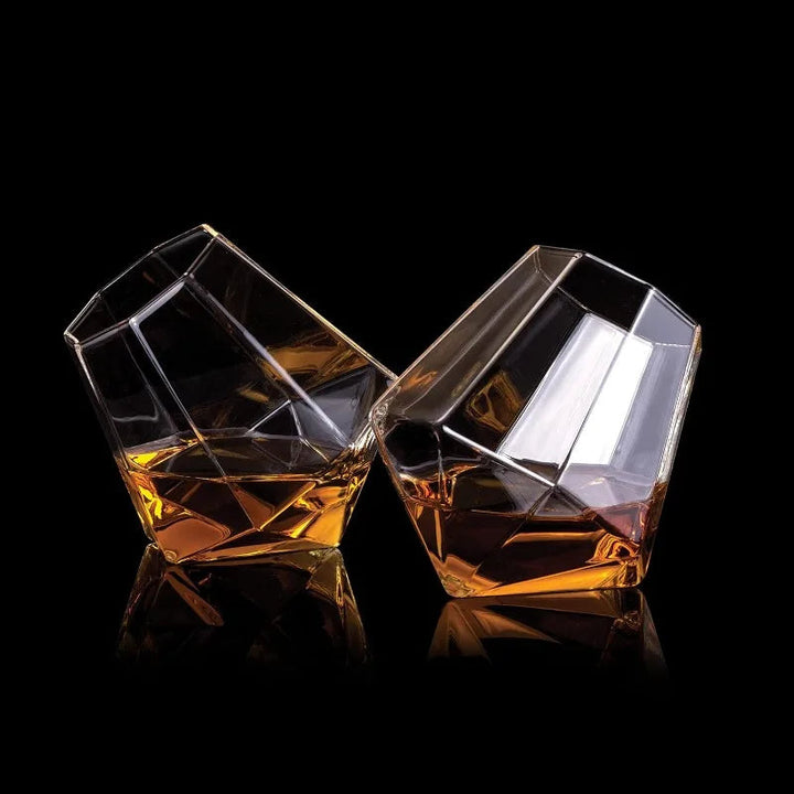 Sophisticated tilted crystal whiskey glass, ideal for spirits. High-quality drinkware tumbler with a unique design.