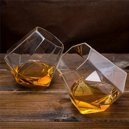 Distinctive tilted whiskey glass made of crystal, a unique gift for spirits lovers & home bar enthusiasts. Stylish barware.