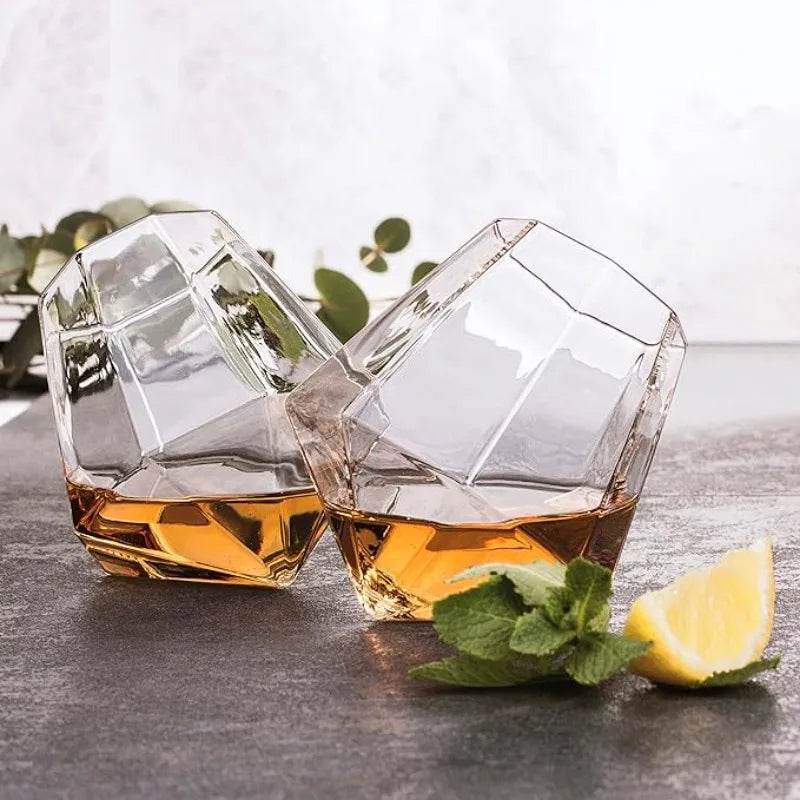 Clear crystal whiskey glass with a unique tilted design, perfect for enjoying spirits. Premium barware tumbler for drinks.