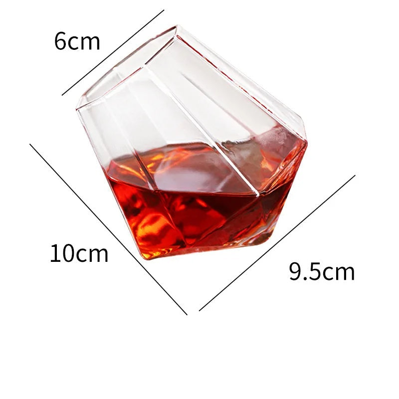 Elegant tilted crystal whiskey glass for spirits. Unique barware drinkware tumbler, an excellent addition to any home bar.