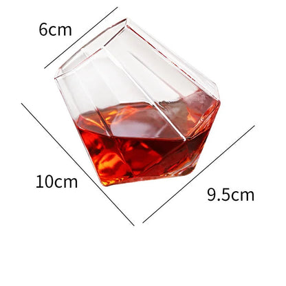 Elegant tilted crystal whiskey glass for spirits. Unique barware drinkware tumbler, an excellent addition to any home bar.