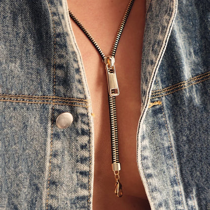 Unique women's zipper necklace, a stylish fashion accessory. Gold and silver tone jewelry for a bold statement.