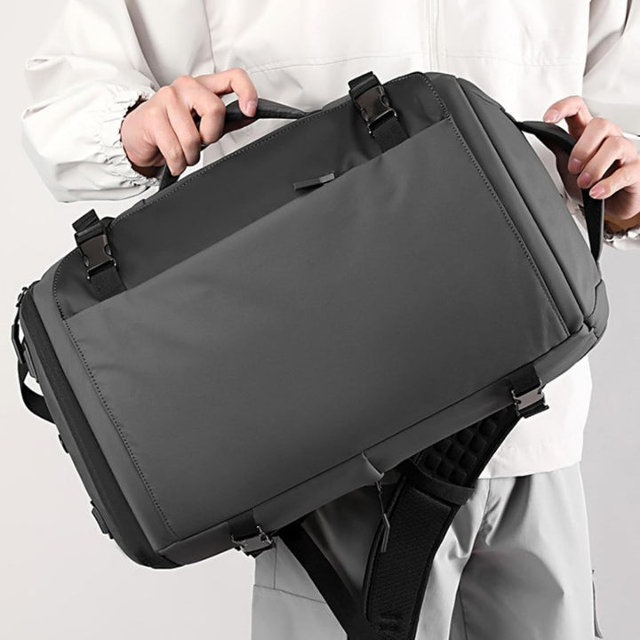 Unisex 15" waterproof laptop backpack, side-open access, USB-C charging for devices on the go.