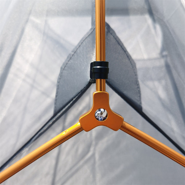 Compact 2-3 person waterproof shelter, packed down for easy transport during camping.