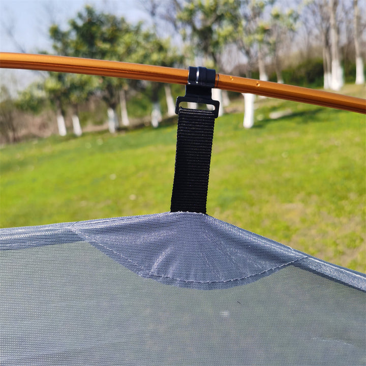 Focus on the durable ripstop fabric of a waterproof all-season camping tent.