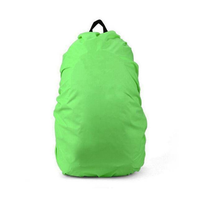 Orange 210D nylon waterproof backpack cover, shown protecting camping gear from rain and elements